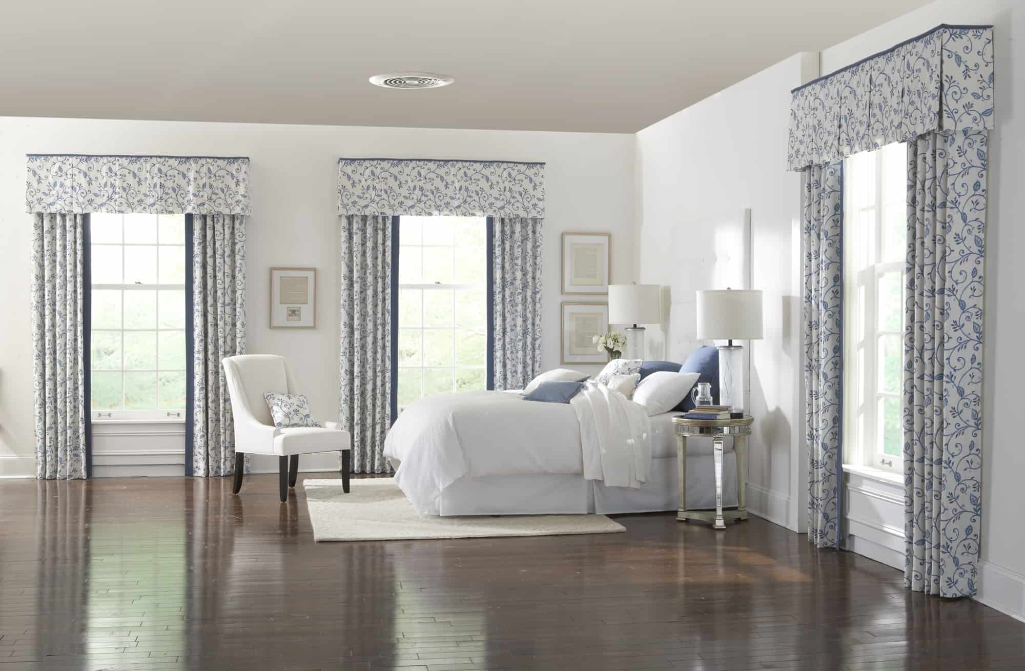 bedroom with costly window treatments