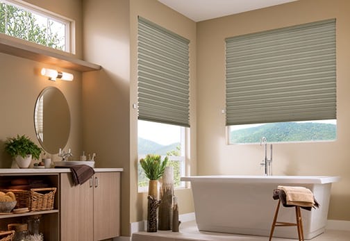 Window Shades 8 Cellular shades in a modern bathroom with freestanding tub.