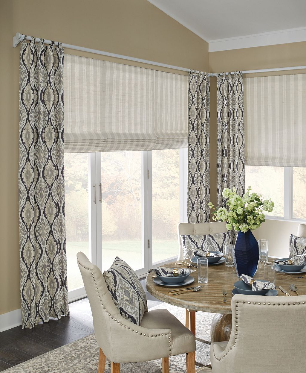 Lexington home dining room featuring elegant draperies and roman shades, creating a warm and sophisticated ambiance