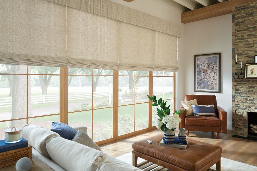 Waterfall Roman Natural Shades in Cultiver, Champignon with Essential Premium Top Natural woven shades with a top treatment, adding warmth and privacy to a room while enhancing its aesthetic appeal